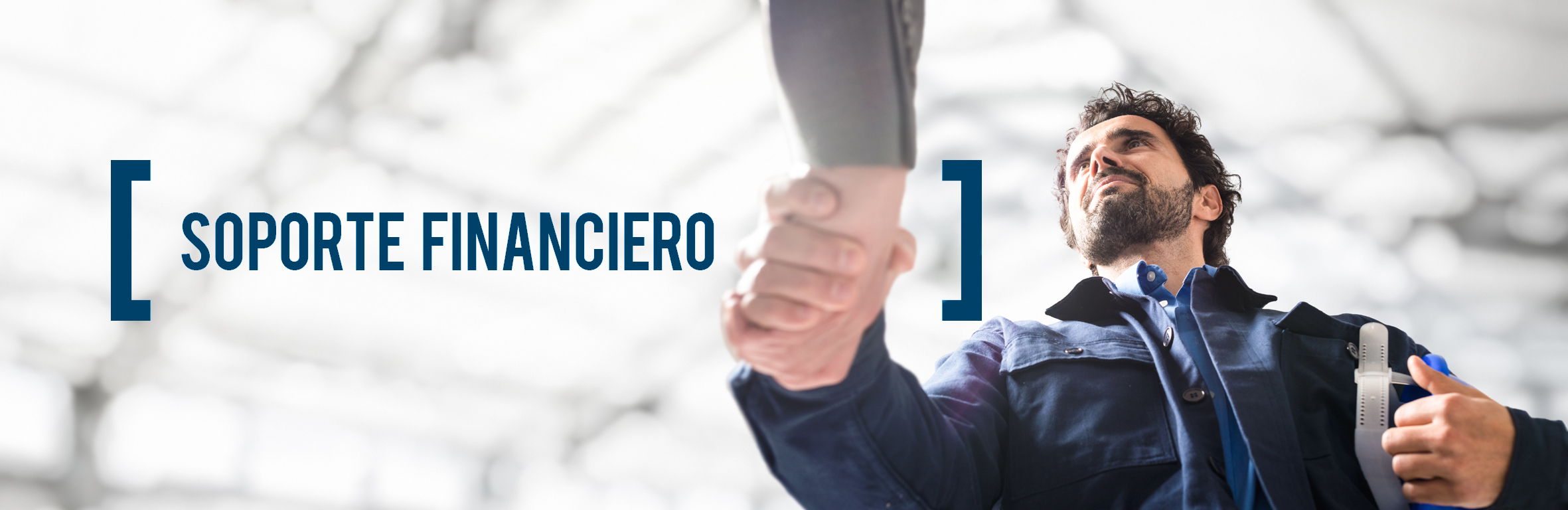 A handsome engineer wearing a hard hat in the control room